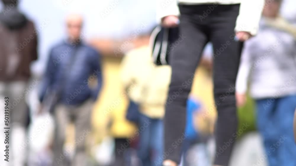 People walking on the street in spring. Out of focus 4k footage People walking on the street in spring. Out of focus 4k footage