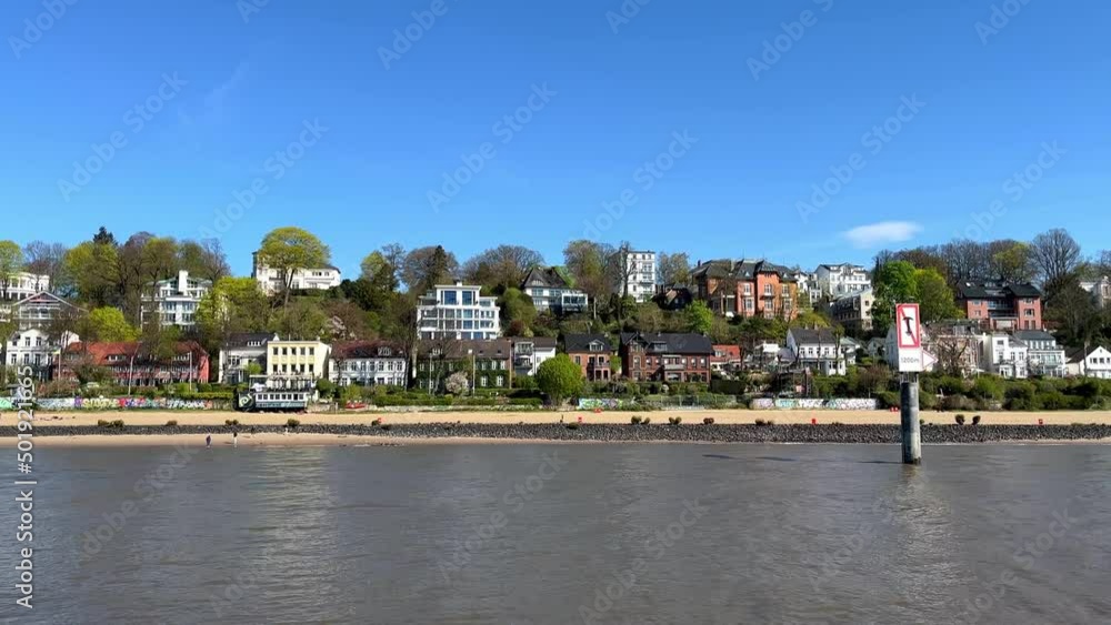 Cruising along the waterfront, beach, and picturesque houses in Hamburg Övelgönne Cruising along the waterfront, beach, and picturesque houses in Hamburg Övelgönne