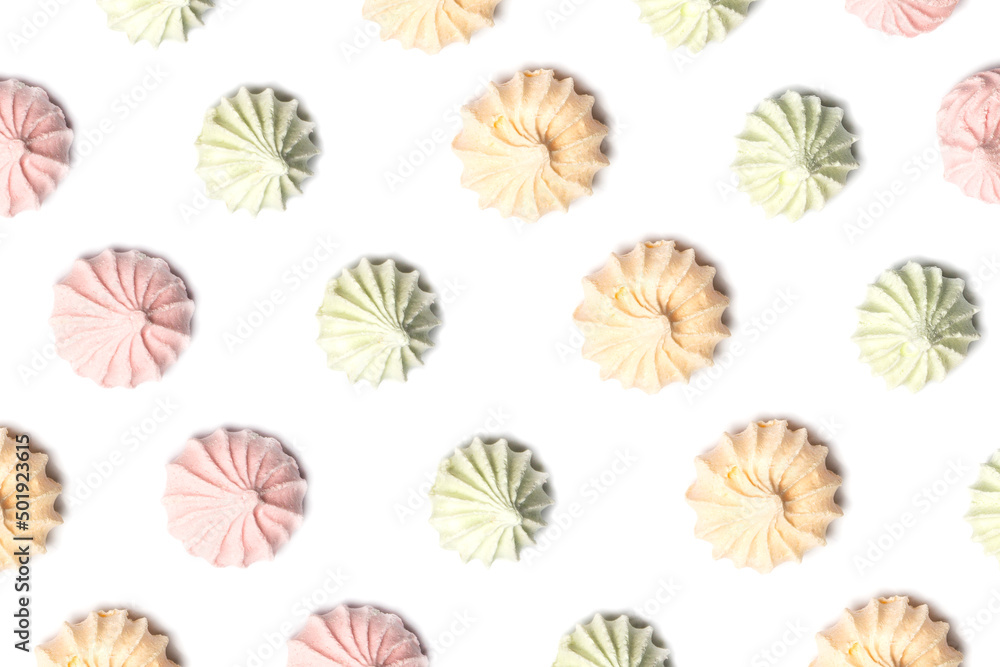 close up of colorful meringues isolated on white background