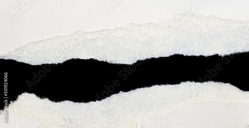a white piece of paper on a black isolated background © Krzysztof Bubel