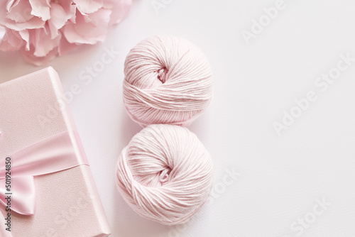 March 8 Women's Day postcard. Spring Festival. Skeins of yarn, knitting needles, accessories for knitting. Handmade, hobby