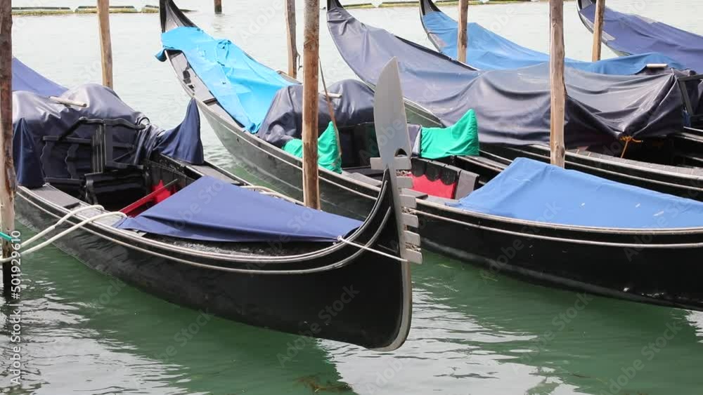 Gondolas are the typical boats of Island of Venice Italy with the characteristic metal bow Gondolas are the typical boats of Island of Venice Italy with the characteristic metal bow