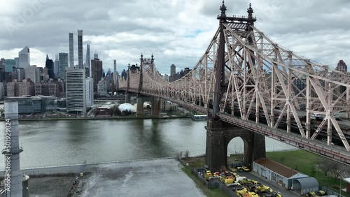 aerial close Queensboro Bridge over East River water toward Manhattan New York City photo