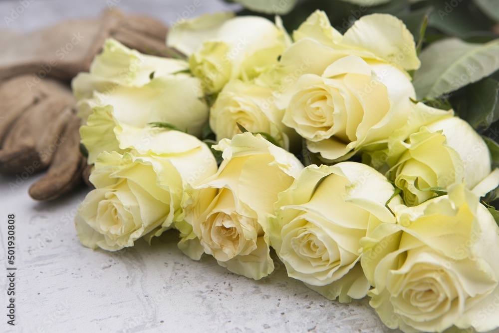 Yellow roses stacked up on table. Yellow roses stacked up on table.