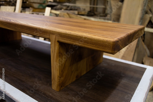 Newly-made brown wooden table in the workshop