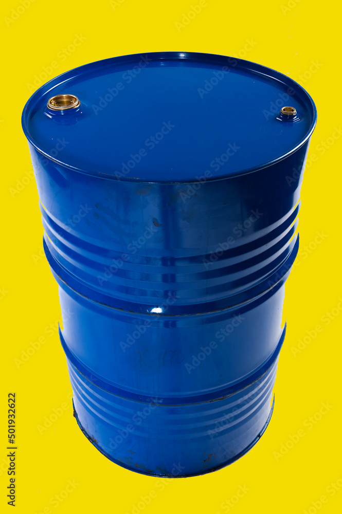 blue metal barrel for fuel oil products on a yellow background