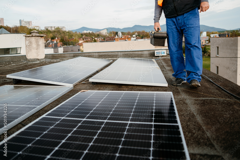 Men worker installing new solar panels. Eco concept alternative energy. Cover photo