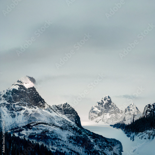 snowy mountains with frozen river