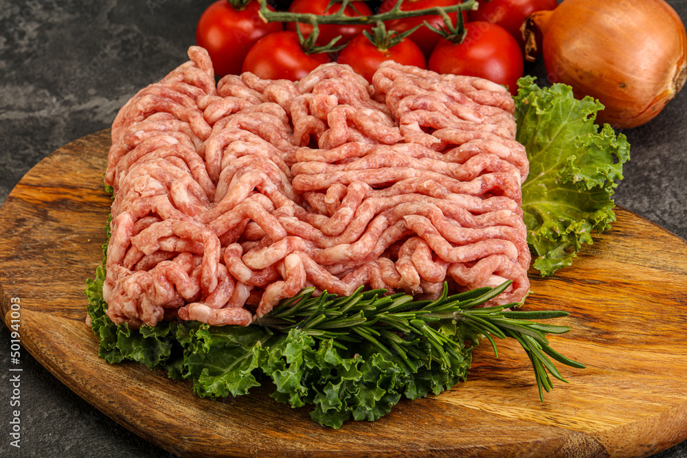 Raw pork minced meat over board Raw pork minced meat over board