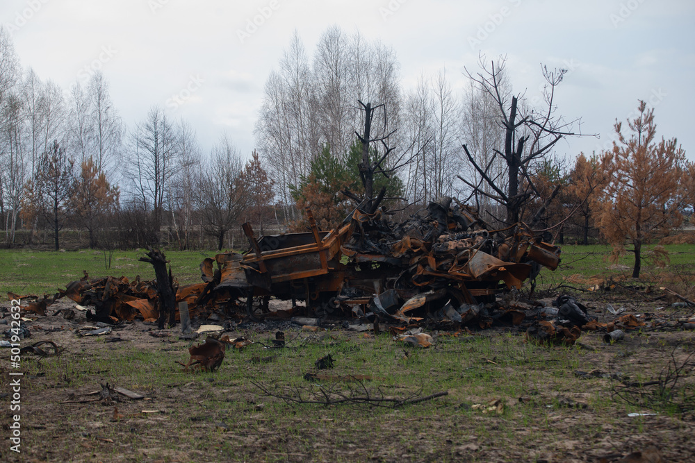 Burnt out military vehicle, after being hit by a shell Burnt out military vehicle, after being hit by a shell