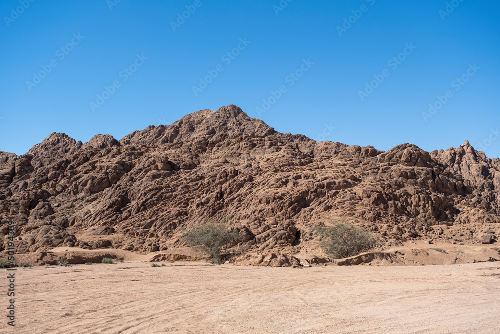 Sharm el Sheikh, Sinai peninsula. Mountains landscape on background. Quadricycle safari park in Egypt sand desert.