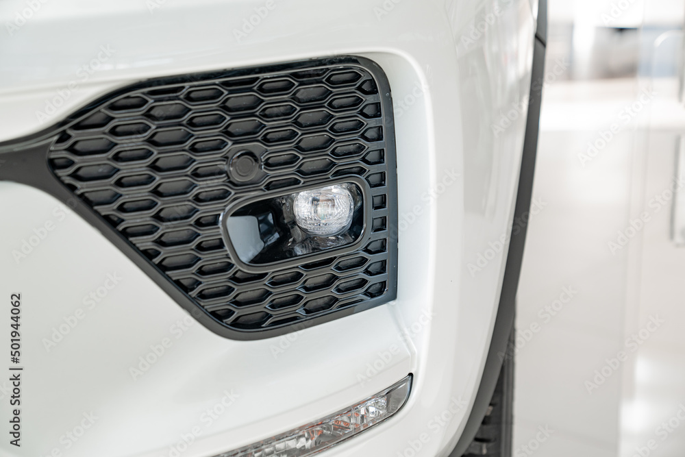 the front fog lights on the white car. official dealerships and auto shops. the front fog lights on the white car. official dealerships and auto shops.