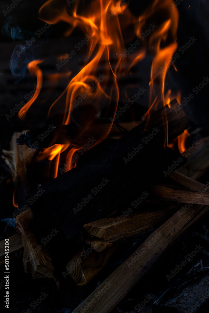 Fototapeta premium Close up shot of burning wood and charcoal used for barbeque