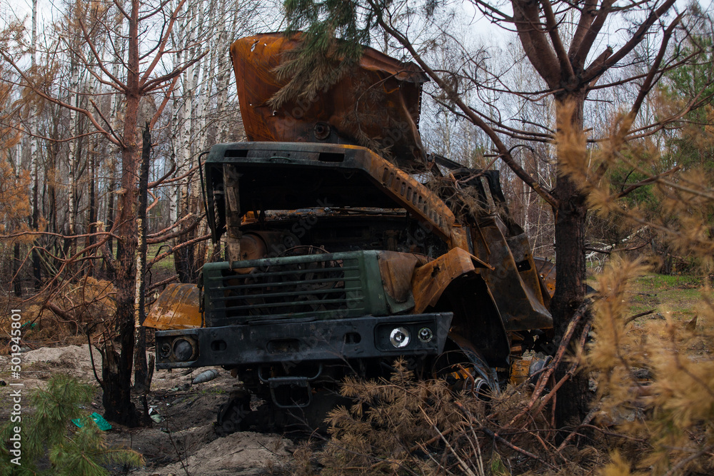 Burnt out truck after being hit by a shell