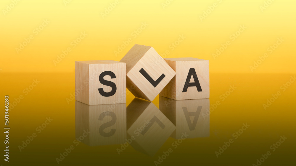 Three wooden cubes with the letters SLA on the bright yellow surface. the inscription on the cubes is reflected from the gray surface of the table. SLA - short for Service Level Agreement Three wooden cubes with the letters SLA on the bright yellow surface. the inscription on the cubes is reflected from the gray surface of the table. SLA - short for Service Level Agreement