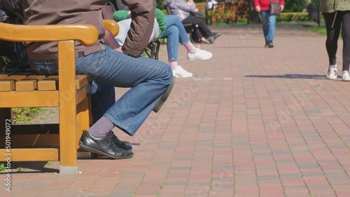 Anonymous People Relaxing Spending Free Time in City Park on Warm Sunny Spring Weekand Day © rohawk