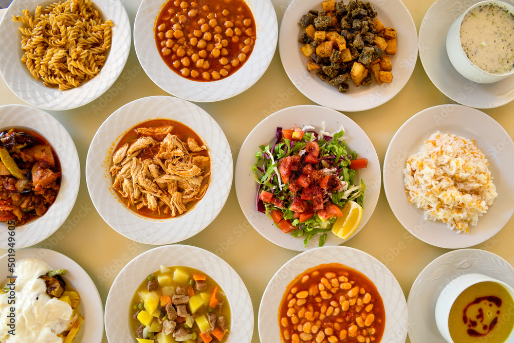 Table scene of assorted take out or delivery foods. Traditional Turkish cuisine. Various Turkish meal and appetizers. Top down view on a table. Table scene of assorted take out or delivery foods. Traditional Turkish cuisine. Various Turkish meal and appetizers. Top down view on a table.