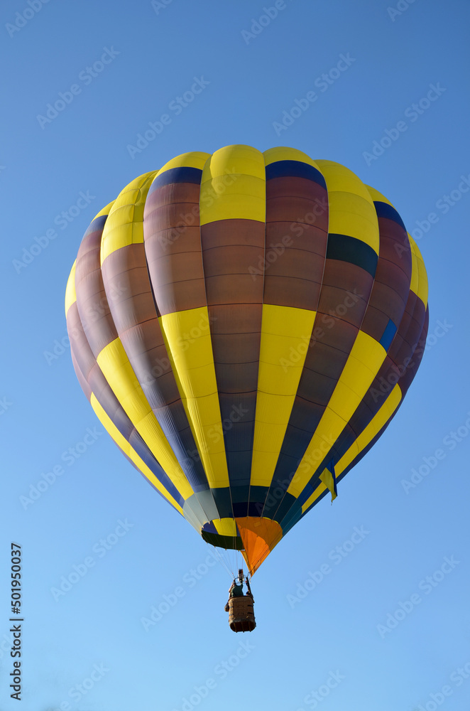 Obraz premium bright yellow blue hot air balloon with Ukrainian flag close-up