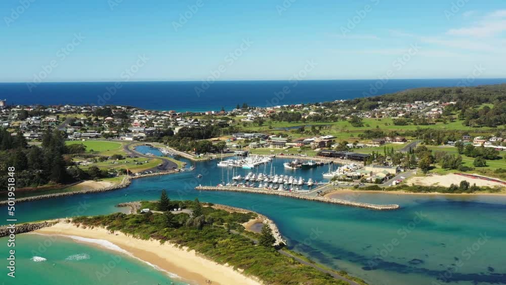 Sandy beach on Bermagui town waterfront in aerial flying to Harbour as 4k.
Sandy beach on Bermagui town waterfront in aerial flying to Harbour as 4k.