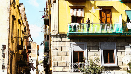Fototapeta Naklejka Na Ścianę i Meble -  Man smoking on the balcony in Naples
