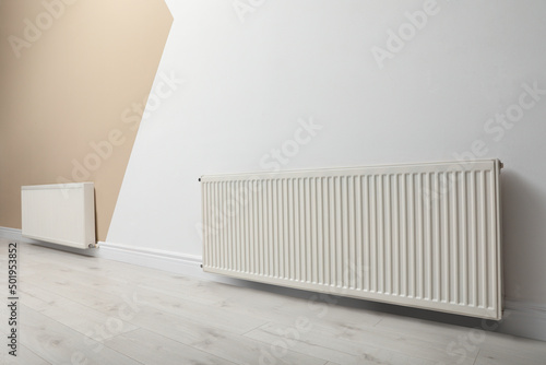 Wallpaper Mural Modern radiators on color wall indoors. Central heating system Torontodigital.ca