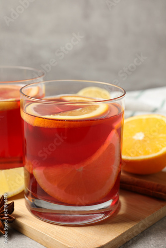 Aromatic punch drink and ingredients on table