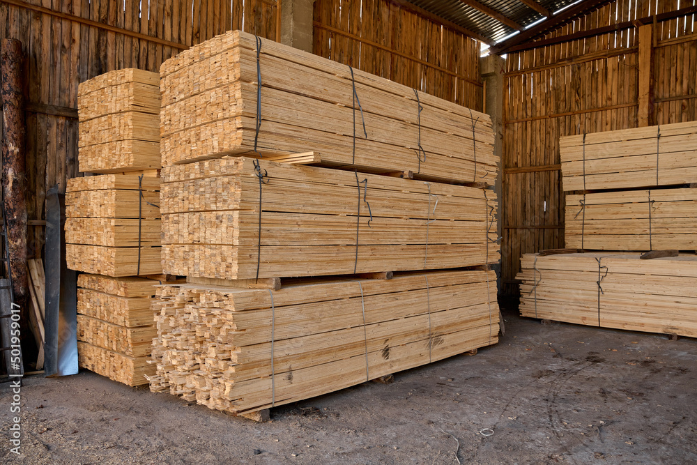 Boards sawn. The saw cut tree is folded. Stacks of plywood. Wood transportation. Boards sawn. The saw cut tree is folded. Stacks of plywood. Wood transportation.