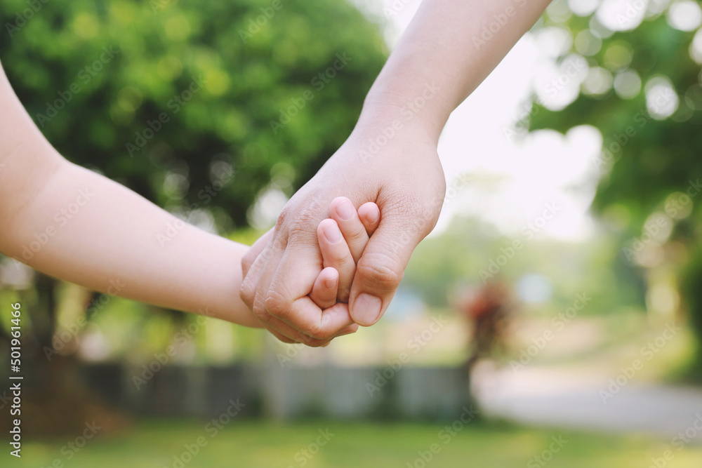 Children's hands with the warmth of mother's care Children's hands with the warmth of mother's care