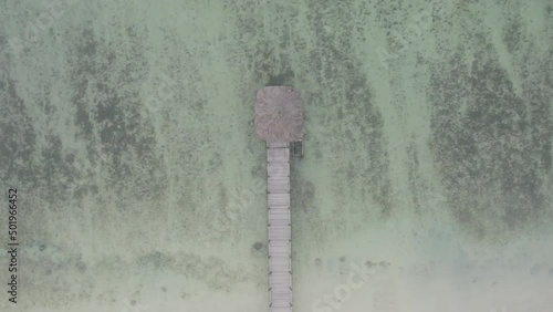 Aerial footage of a pier at St. Felix beach which is located in the south of Mauritius island