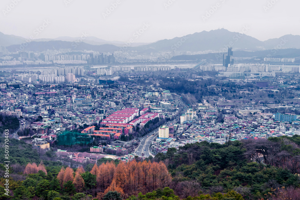 Seoul cityscape, skyline, high rise office buildings in Seoul city, winter daylight Crack on an ice surface of frozen Han river top view in winter, Seoul, Republic of Korea, in fog winter