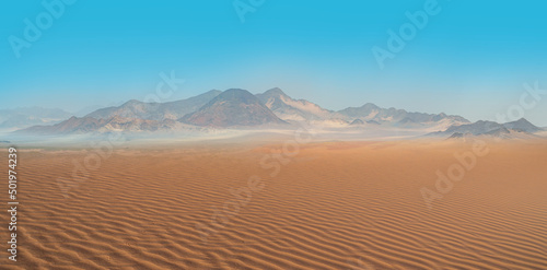 Panoramic view of orange sand dune desert with clear blue sky at Namib desert - Namibia