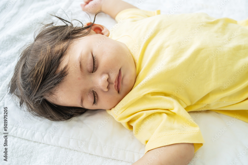 Cute,Portrait of little infant or baby sleeping on bed with comfort. Adorable newborn kid concept Cute,Portrait of little infant or baby sleeping on bed with comfort. Adorable newborn kid concept