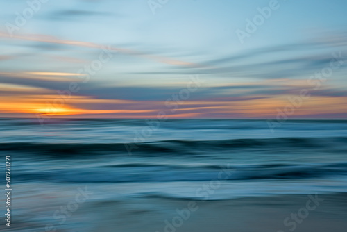 Tropical beach sunset, abstract. Beautiful sea, and colorful sky. Motion blur, line art