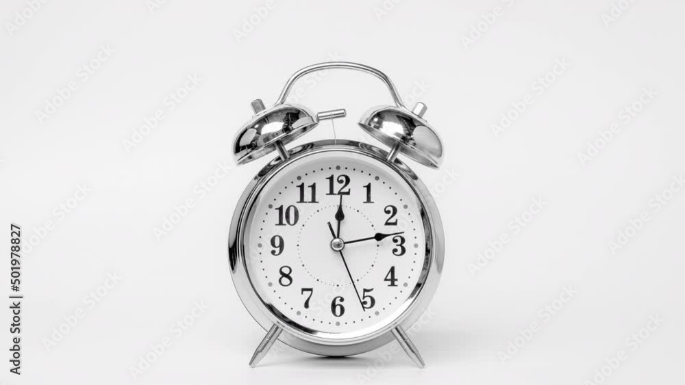 Time lapse of retro alarm clock running isolated on white background. Twelve o'clock on The New Years of the beautiful alarm clock face. Stop motion Animation of Alarm clock running. Time lapse of retro alarm clock running isolated on white background. Twelve o'clock on The New Years of the beautiful alarm clock face. Stop motion Animation of Alarm clock running.