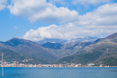 view of the Kotor bay, Montenegro among mountains and clouds in blue sky. beautiful panorama coastline landscape. travel destination