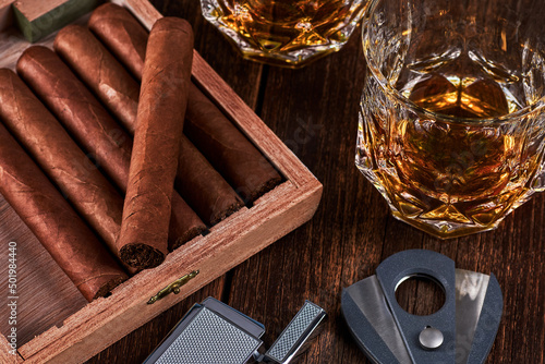 Canvastavla Box with cuban cigars, lighter and cutter on old wooden table top
