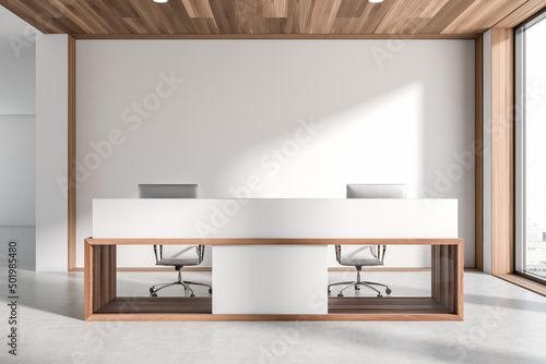Light reception interior desk with two computers and window, mockup
