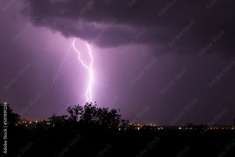 lightning striking some place in city at night