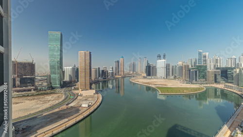 Cityscape skyscrapers of Dubai Business Bay with water canal aerial timelapse. © neiezhmakov