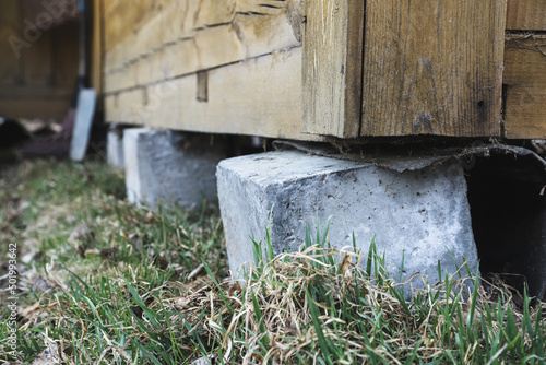 Wallpaper Mural Rickety concrete support of a country house close-up. Selective focus Torontodigital.ca