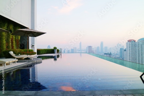 Swimming pool view on top floor of stylish upscale hotel in Bangkok, Thailand