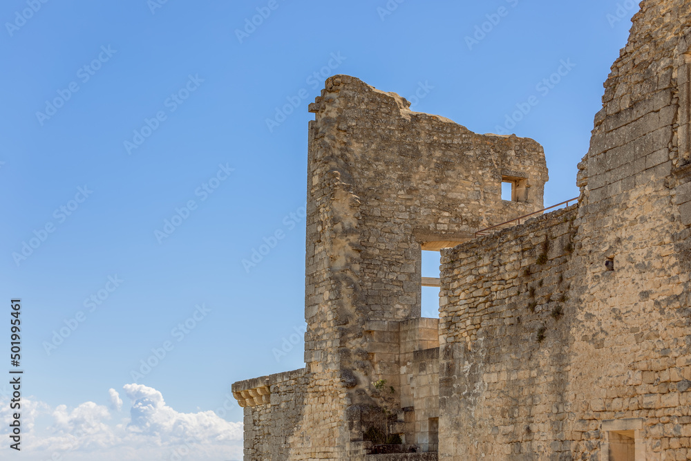 Remains of historical monument of ancient Lacoste village (Chateau de Lacoste) on blue sky background, Vaucluse, France