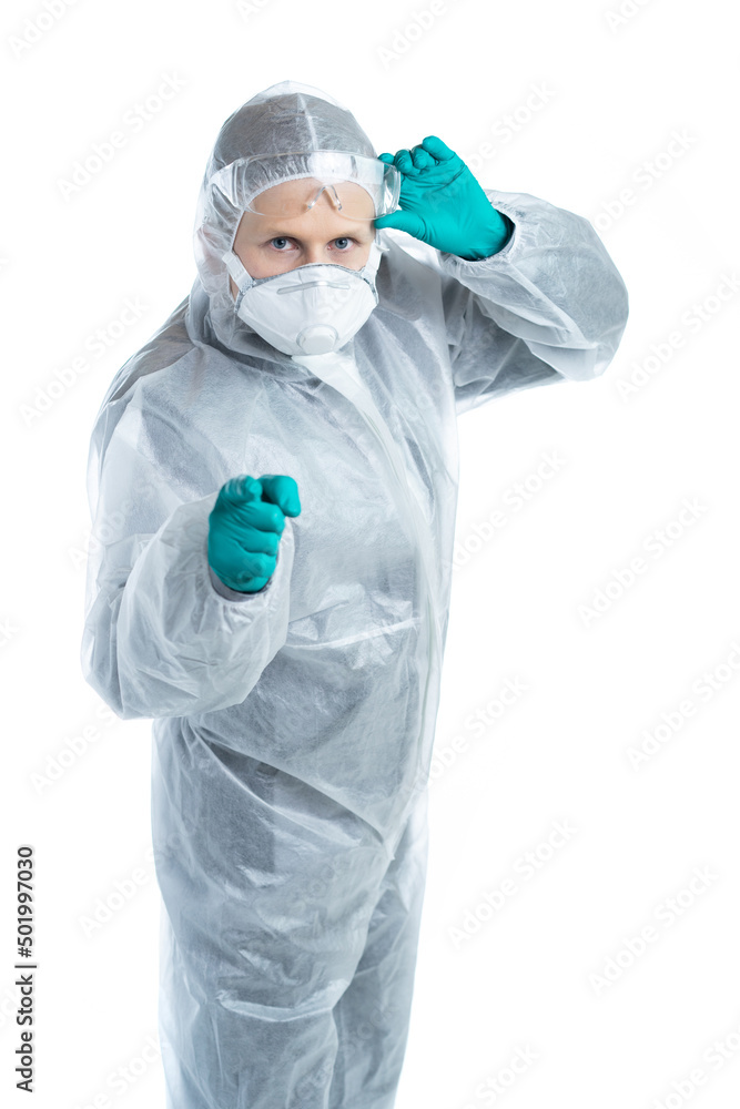 The man in protective uniform raised his glasses. the specialist carefully looks at us and points a finger. the doctor noticed a patient with a coronovirus or a threat of an epidemic, danger. isolated The man in protective uniform raised his glasses. the specialist carefully looks at us and points a finger. the doctor noticed a patient with a coronovirus or a threat of an epidemic, danger. isolated