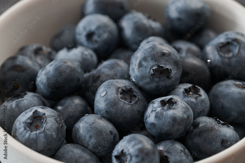 Fresh washed blueberries in white bowl closeup Fresh washed blueberries in white bowl closeup