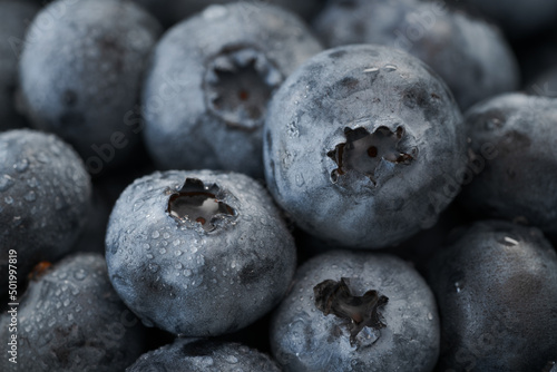 Fresh clean blueberries with drops of water macro shot