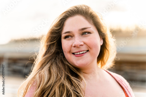 Beautiful plus size young woman outdoors, concepts about body acceptance, body positive and self esteem