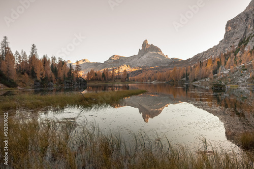 An alpine lake among the dolomites with reflection photo