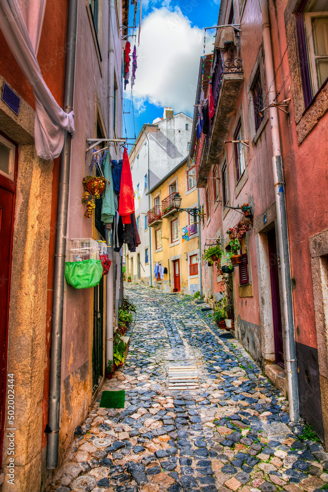 Fototapeta premium Narrow Street in Alfama, Lisbon, Portugal