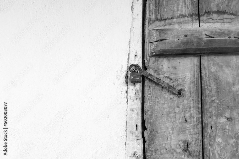 wooden door and there is a lock on it, the old classic house door with the lock wooden door and there is a lock on it, the old classic house door with the lock