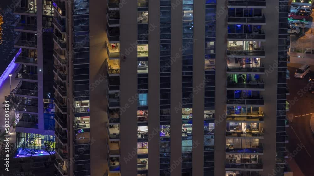 Light in windows of modern towers. Exterior of apartment building at night with glowing windows timelapse. Light in windows of modern towers. Exterior of apartment building at night with glowing windows timelapse.